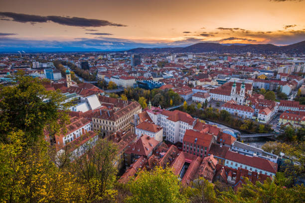 aerial view of the city of graz at sunset, styria, austria - graz austria clock tower styria imagens e fotografias de stock