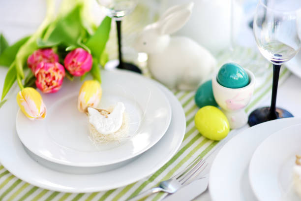 istock Beautiful table setting with crockery and flowers for Easter celebration 938866832
