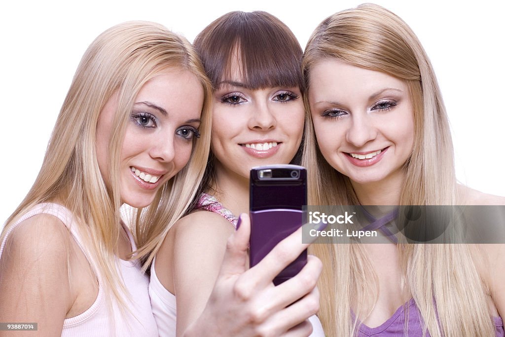 Três Meninas com Telefone - Royalty-free A usar um telefone Foto de stock