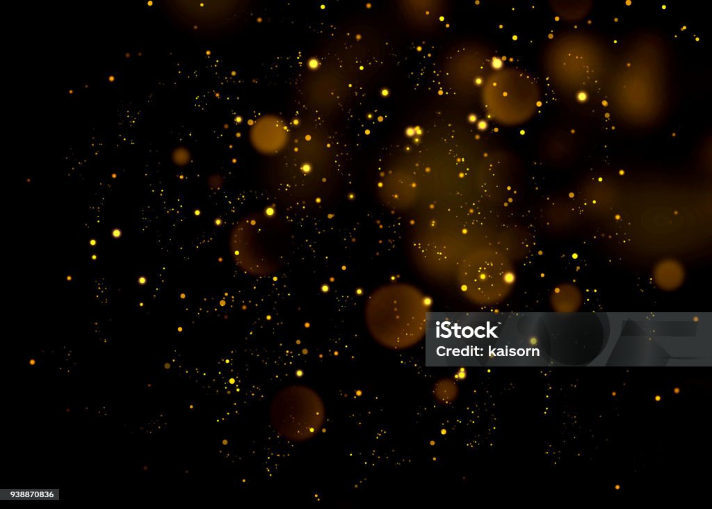 Gold glittering star light and bokeh.Magic dust abstract background element for your product. Glittering Stock Photo