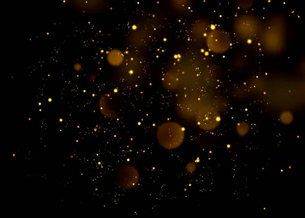 Photo of Gold glittering star light and bokeh.Magic dust abstract background element for your product.