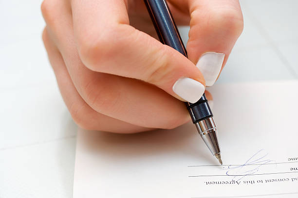 istock Businesswoman signing contract 93887365