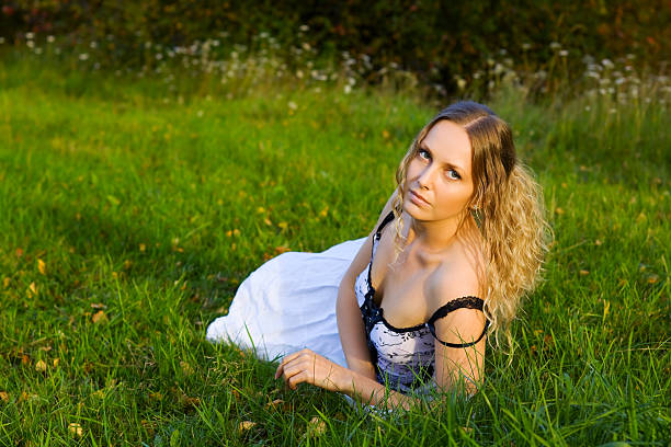 istock Beautiful young woman on the grass 93888845
