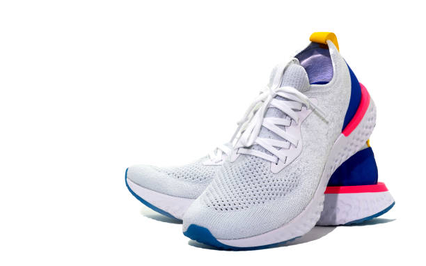 istock White sport shoes on isolated white background with copy text space 938896378