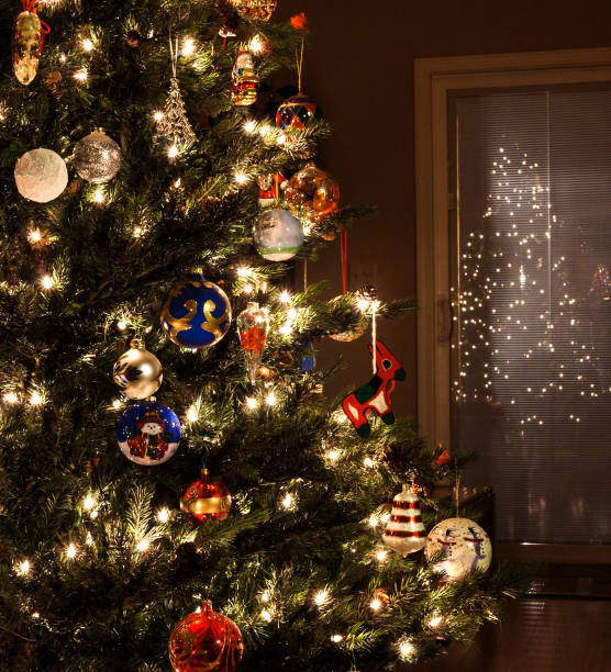 istock Holiday Christmas Tree Ornaments and Lights Close-up 938907770