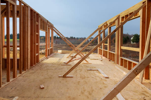 istock New residential construction home framing against blue sky 938915410