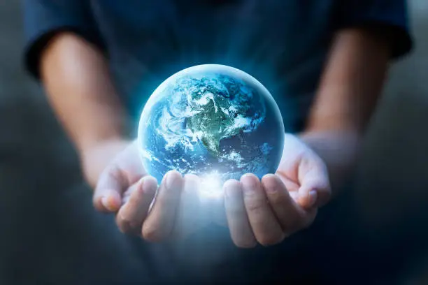 Photo of Earth day, Human hands holding blue earth, save earth concept. Elements of this image furnished by NASA