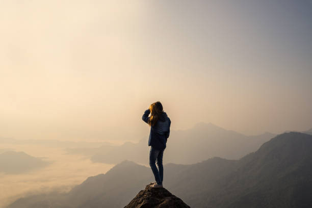 istock Young traveler standing and looking at beautiful landscape 938927674