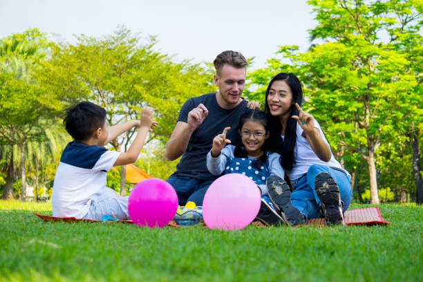 istock Happy Family Enjoying At Park 938930016