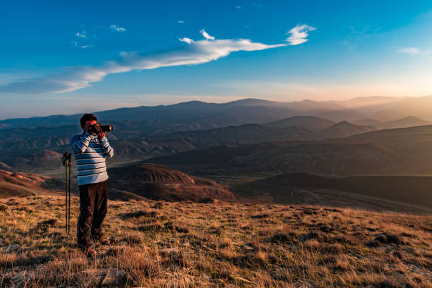 Nature photographer in mountains