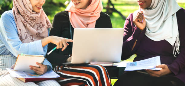 istock Group of islamic friends discussing and working together 938931974