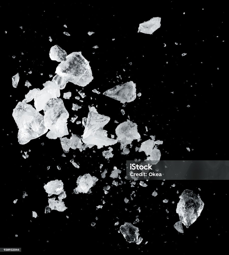 ice blocks splash ice blocks splash isolated on black background Ice Stock Photo