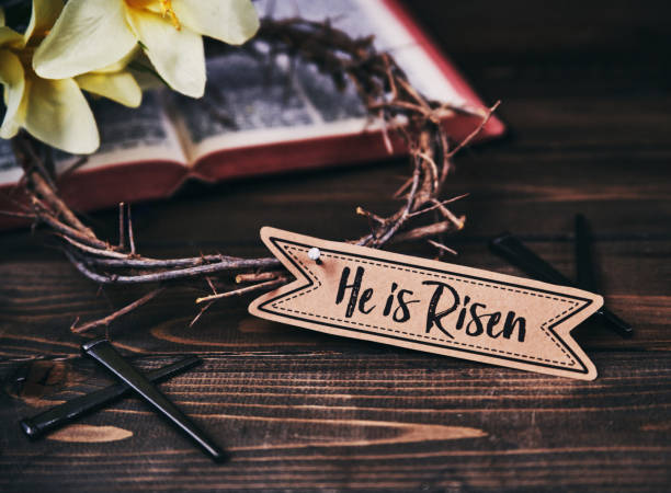 istock Crown of Thorns with Bible and Lilies on Rustic wood for Easter 938938496
