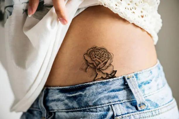 Closeup of lower hip tattoo of a woman
***This tattoo is derived from our own 3D generic designs. They do not infringe on any copyright design.