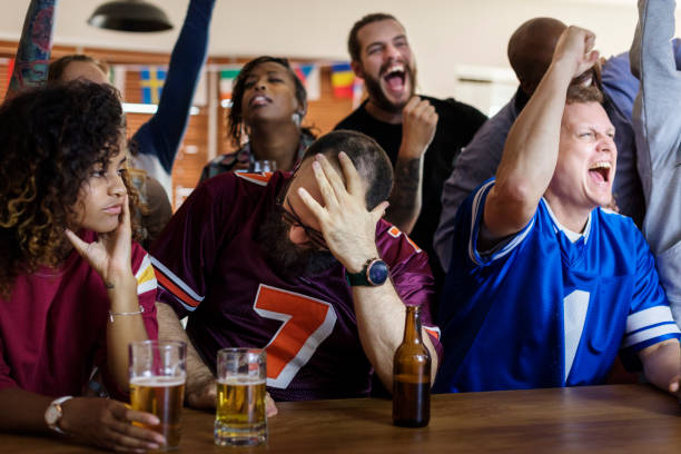 istock Friends cheering sport at bar together 938939080