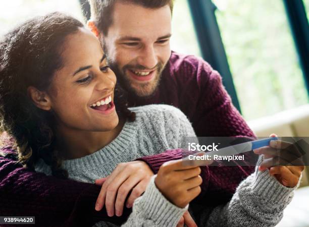 Happy Couple With Pregnancy News Stock Photo - Download Image Now - Pregnancy Test, Women, Pregnant