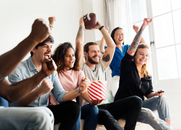 istock Friends cheering sport league together 938944692