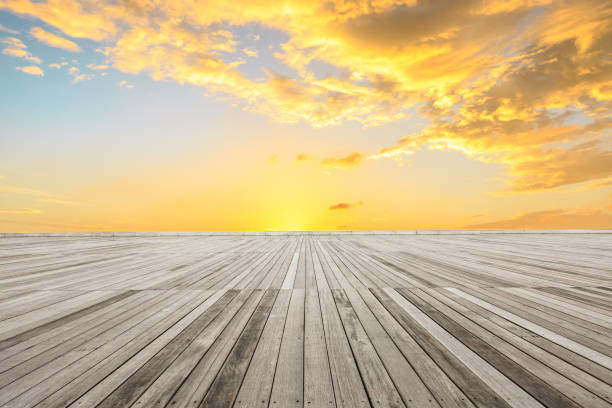 istock wood square floor and sky clouds at sunset 938944768