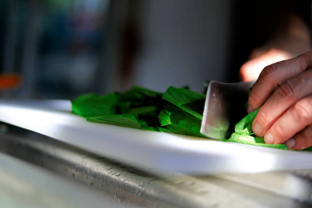 hands with cutting vegetables in kitchen in the morning