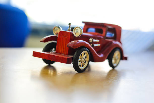 istock ancient wooden car on the table.transportation concept. 938950308