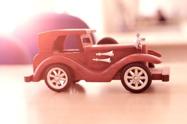istock ancient wooden car on the table.transportation concept. 938950426