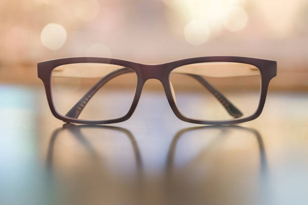 istock Pastel eye glasses on wood background with bokeh. 938963798
