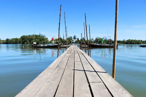 istock bridge to the sea. 938963886