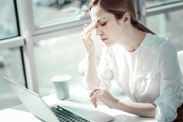 istock Overloaded tired woman working and having head ache 938966900