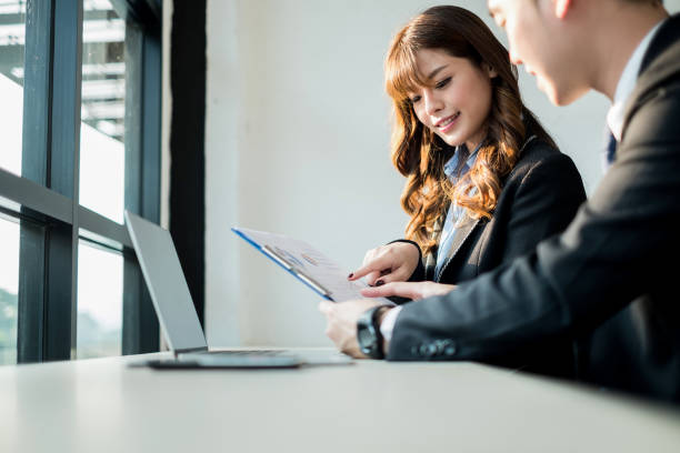 istock business people meeting brainstorming and discussing project together in office, teamwork concept 938971890