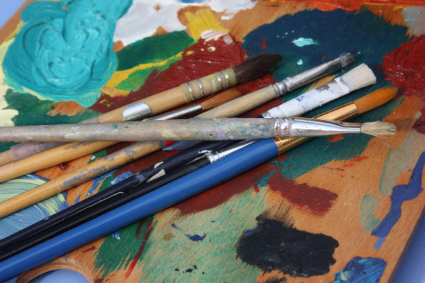 istock Palette of paint and brushes 938972948