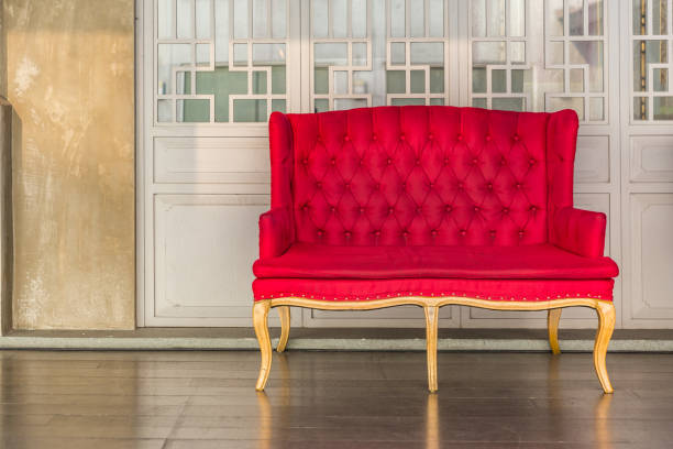 istock Red sofa with window background, interior design in Morning light 938977084
