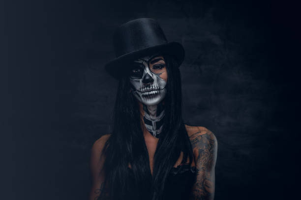 istock A woman with painted skull face. 938977244