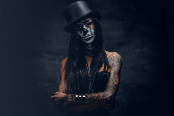 istock A woman with painted skull face. 938977494