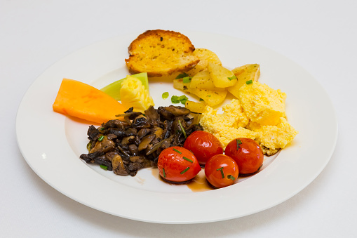 Fried tomato and mushroom with scrambled egg for catering at Spring Festival picnic event