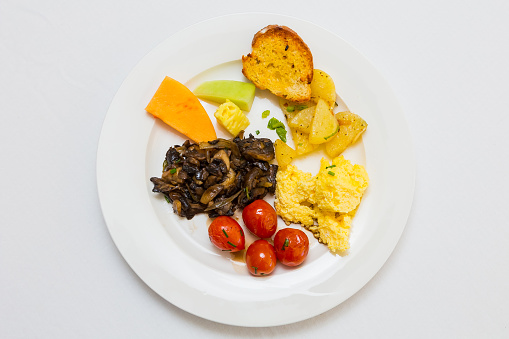 Fried tomato and mushroom with scrambled egg for catering at Spring Festival picnic event