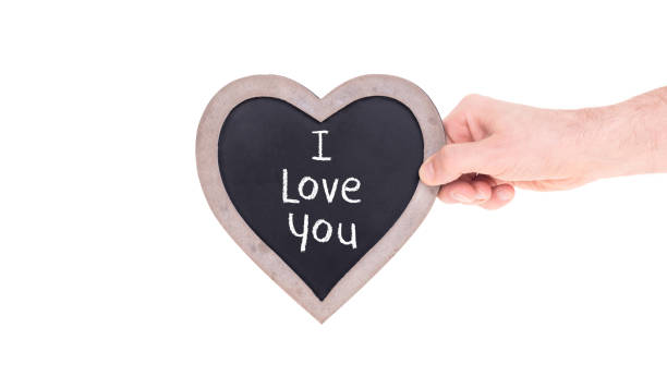 istock Adult holding heart shaped chalkboard 938980674
