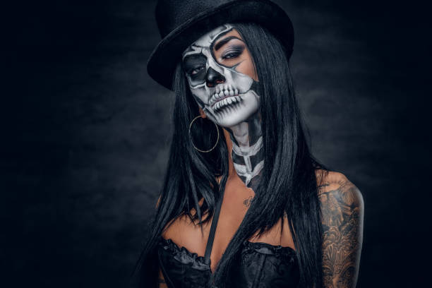 istock A woman with painted skull face. 938980728