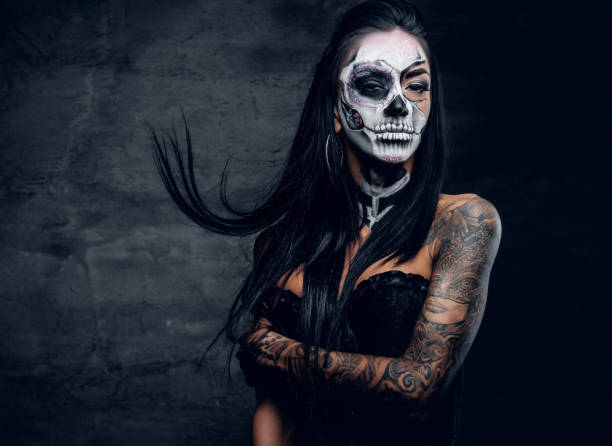 istock A woman with painted skull face. 938981020