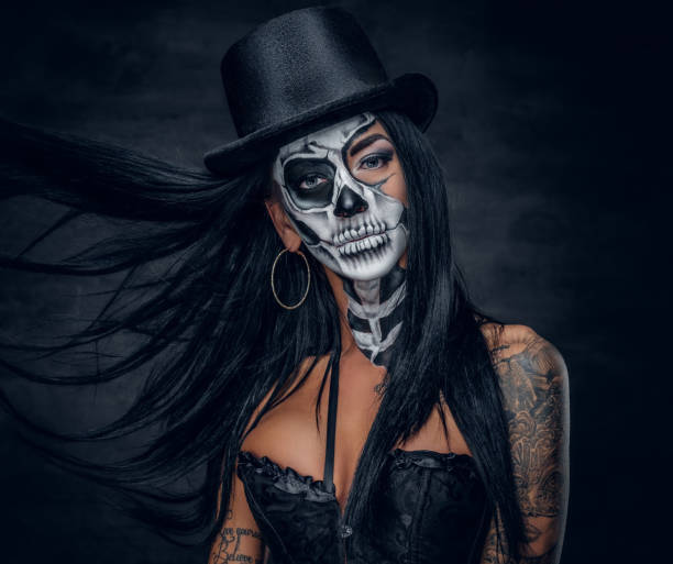 istock A woman with painted skull face. 938981854