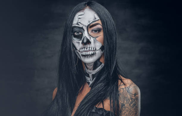 istock A woman with painted skull face. 938982024