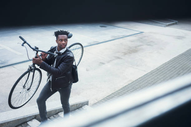 istock Young businessman with bike 938985824