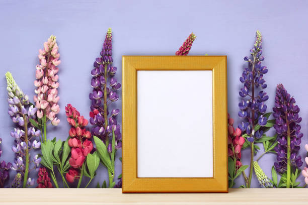 istock Empty frame for photo on backdrop of flowers. 938985946