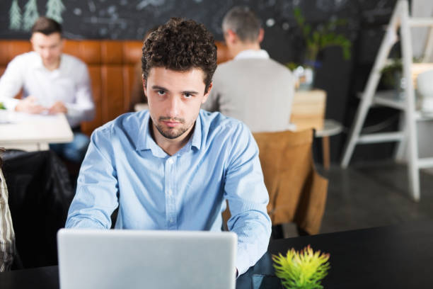 istock Young businessman in a cafe 938986498