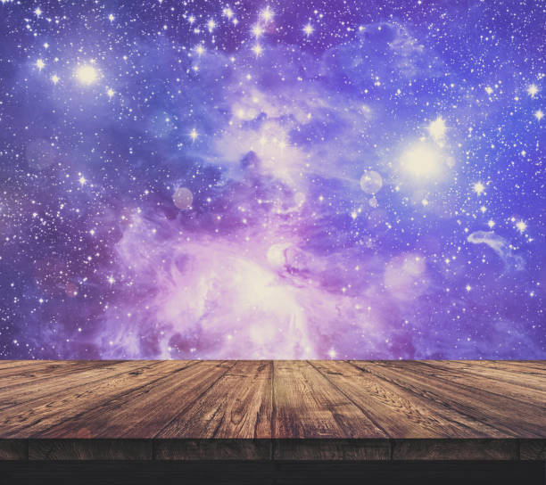 istock Wood table top with blurred light colourful bokeh abstract background 938986864