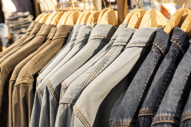 istock some used clothes hanging on a rack in a flea market 938989674