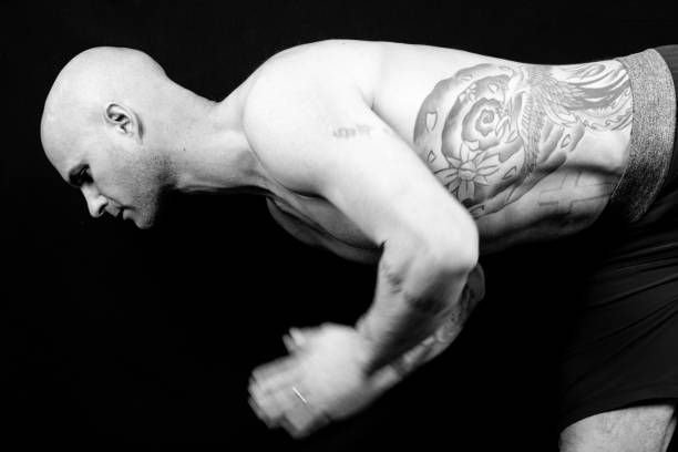 istock Muscular man meditates during yoga 938993212