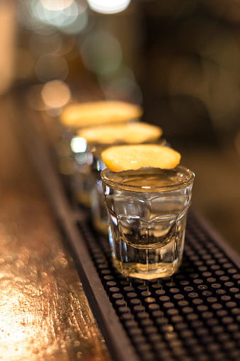 Tequila Shots with Lime in a bar