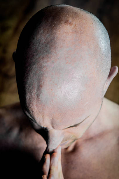 istock Muscular man meditates during yoga 938994168