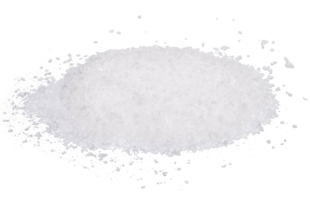 istock Rock white sea salt isolated on white background 938995054