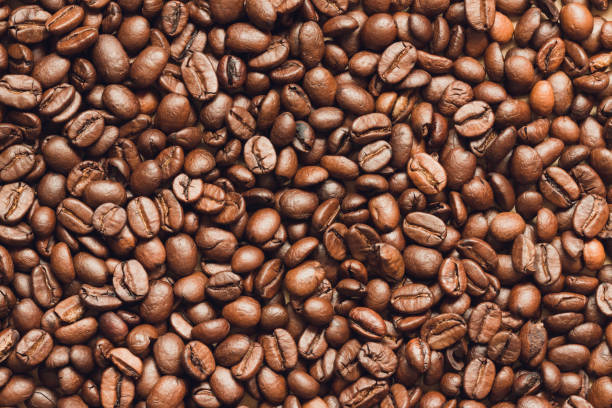 istock Coffee beans background wallpaper inspiration 938995346